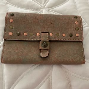 Patricia Nash trifold wallet, look is leather worn, tons of space.